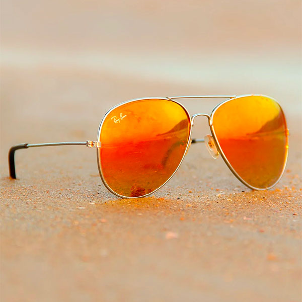 Ray-Ban Avaitor sunglasses on a beach Ray-Ban Avaitor sunglasses on a beach